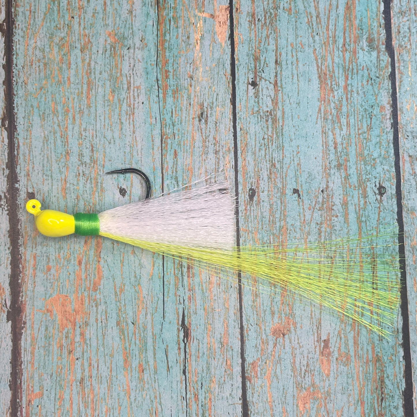 Mini Flare Hawk Jig. Peacock and Snook Candy